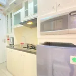 Well Furnished Studio Room At Grand Asia Afrika Apartment By Travelio